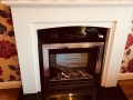 Blanco marble with black granite fireplace